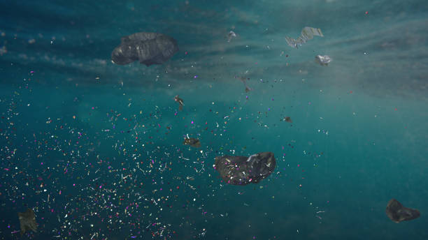 Microplastics floating in water, highlighting the pollution crisis in oceans and waterways.