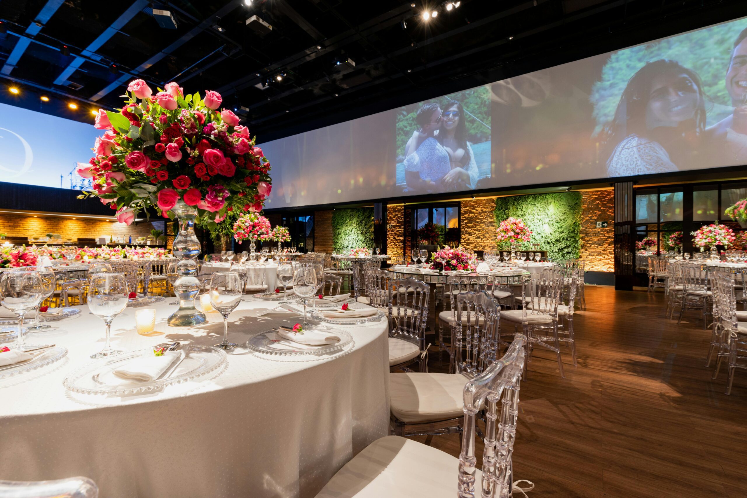 A luxurious banquet hall with grand floral centerpieces, elegant table settings, and upscale lighting, ideal for an exclusive lifestyle event.