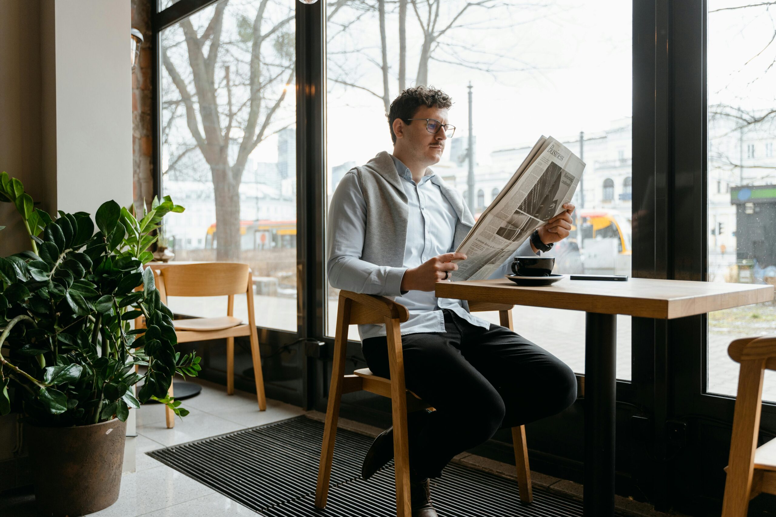 A boy reading newspaper getting latest news From Torro News