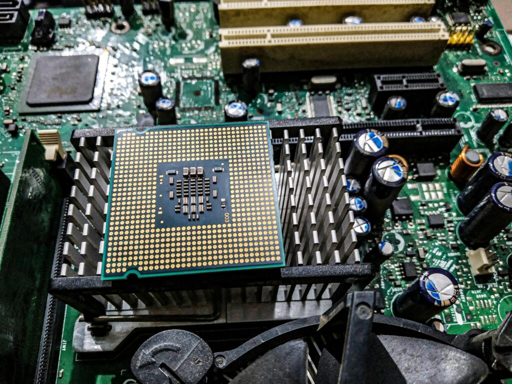 Close-up of a circuit board showcasing electronic components, representing the advanced technology behind DB Technology Hoot Circuit Boards.